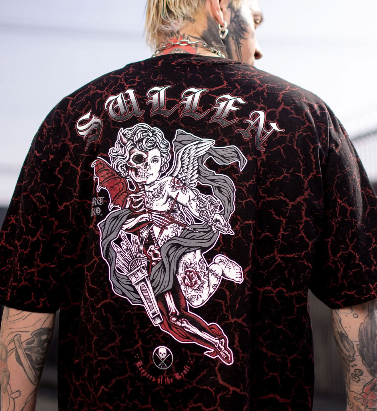 Black t-shirt with a graphic design and 'Sullen' branding on the back.